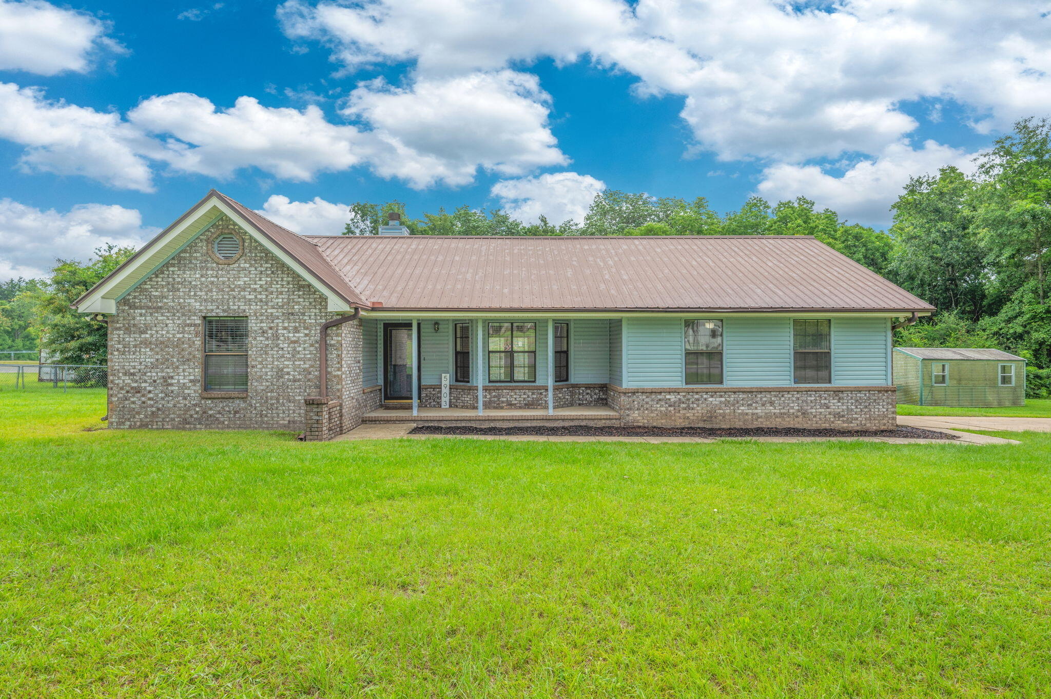 5903 Jack Stokes Road Baker, FL 32531 - Photo 2 of 35 a view of a house with a garden