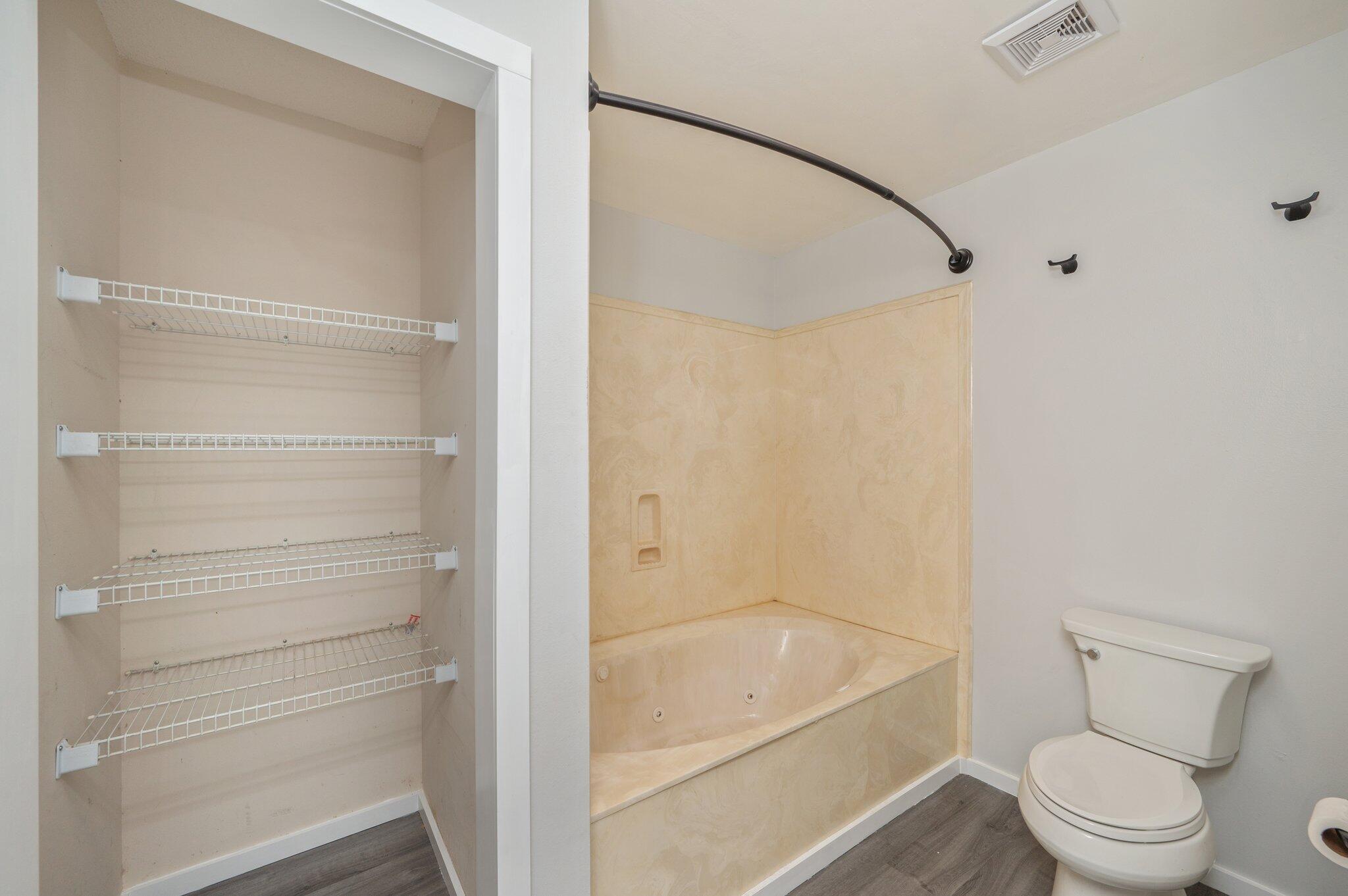 5903 Jack Stokes Road Baker, FL 32531 - Photo 21 of 35 a bathroom with a bathtub and toilet