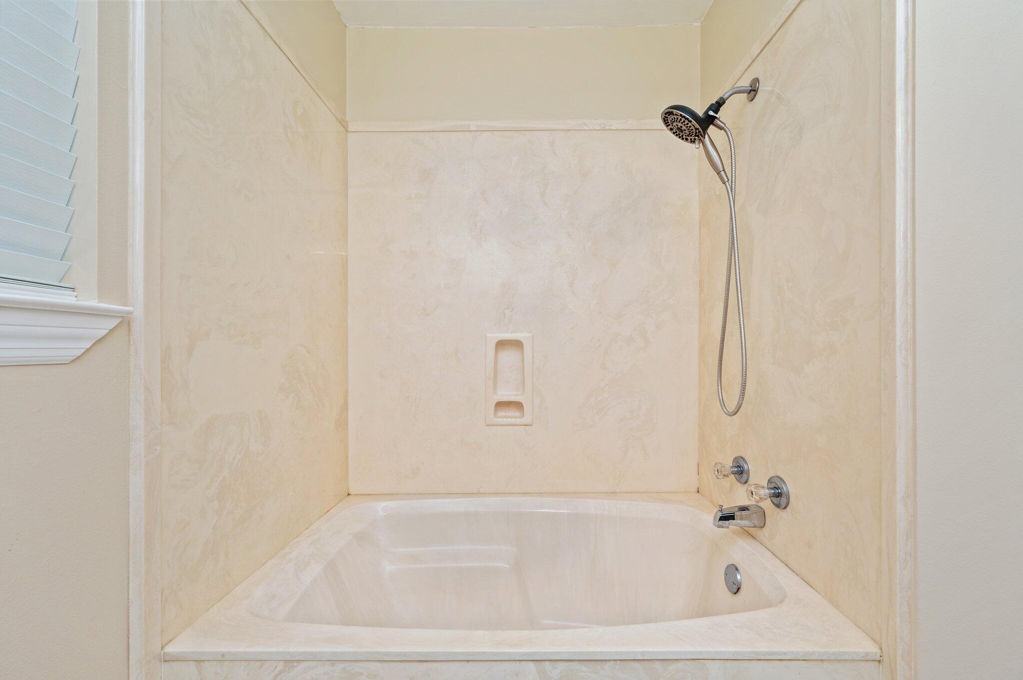 5903 Jack Stokes Road Baker, FL 32531 - Photo 28 of 35 a bathroom with a bathtub