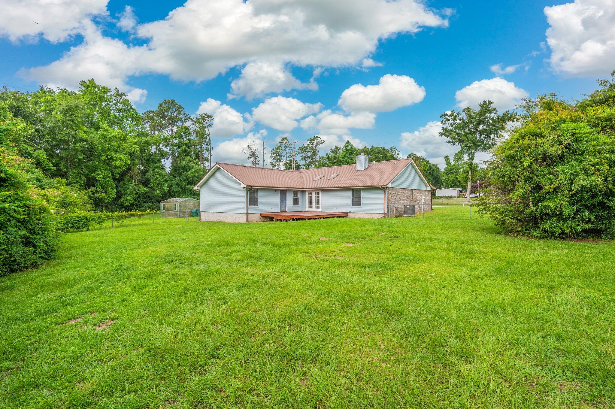 5903 Jack Stokes Road Baker, FL 32531 - Photo 32 of 35 a view of a house with a yard