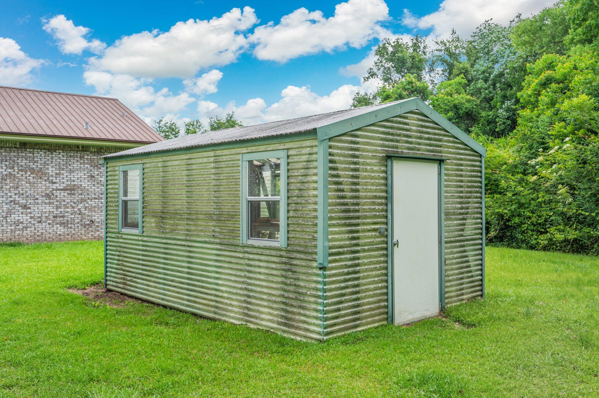 5903 Jack Stokes Road Baker, FL 32531 - Photo 34 of 35 a view of a house with a yard