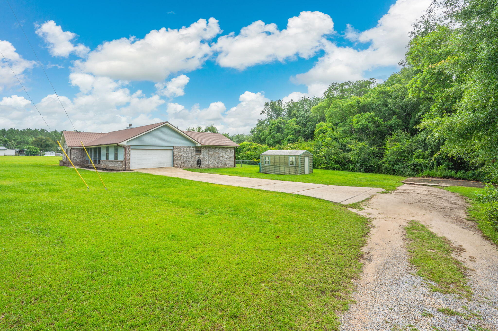 5903 Jack Stokes Road Baker, FL 32531 - Photo 4 of 35 a view of a house with a yard