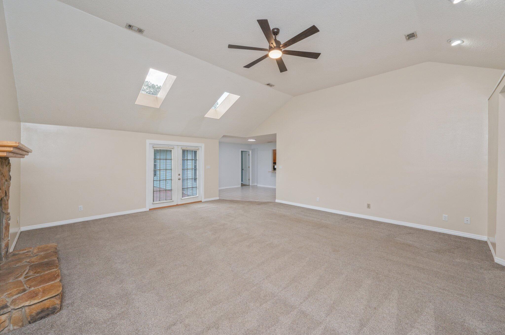 5903 Jack Stokes Road Baker, FL 32531 - Photo 5 of 35 an empty room with a empty space and a ceiling fan