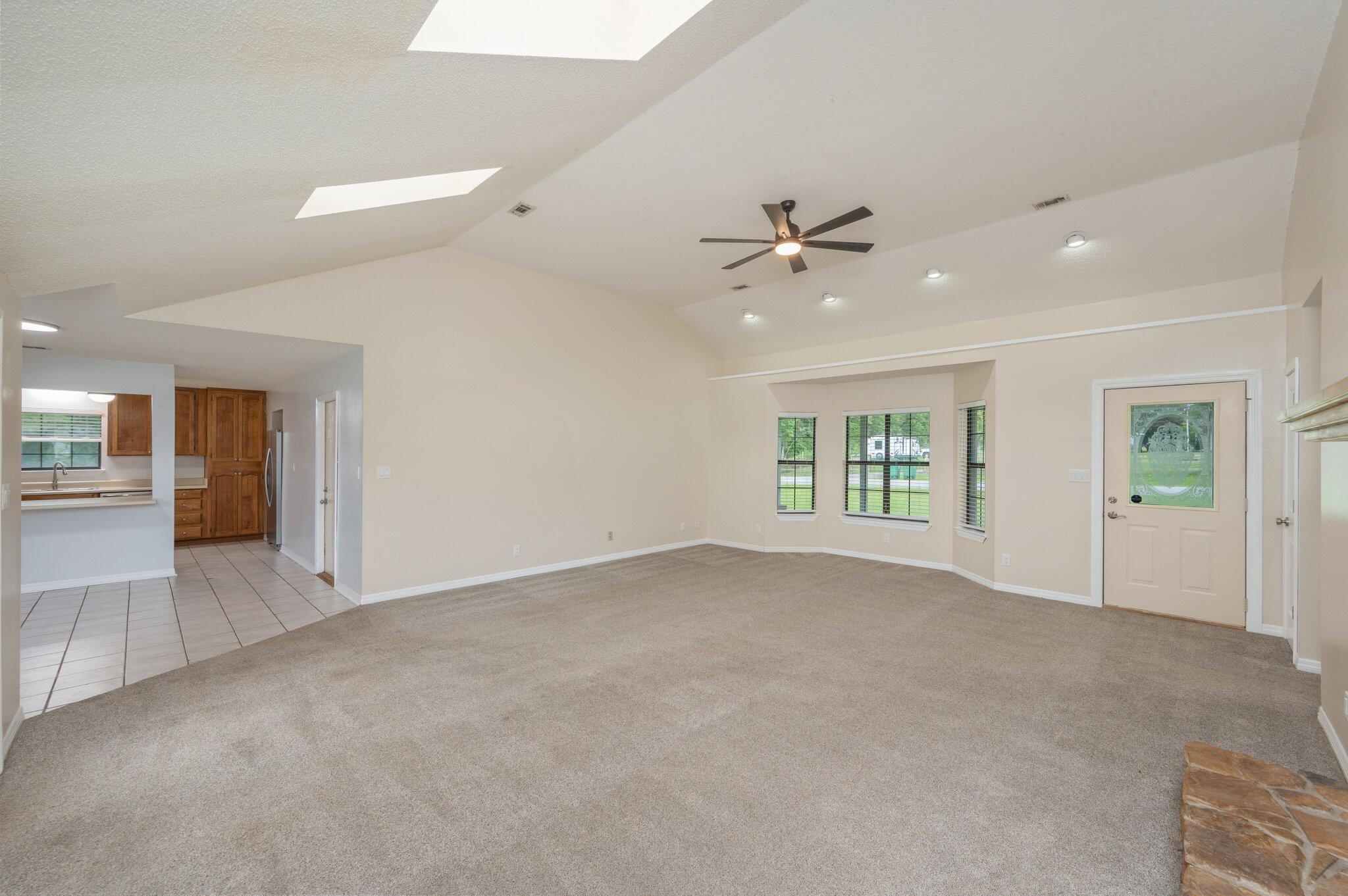 5903 Jack Stokes Road Baker, FL 32531 - Photo 8 of 35 an empty room with fan and windows