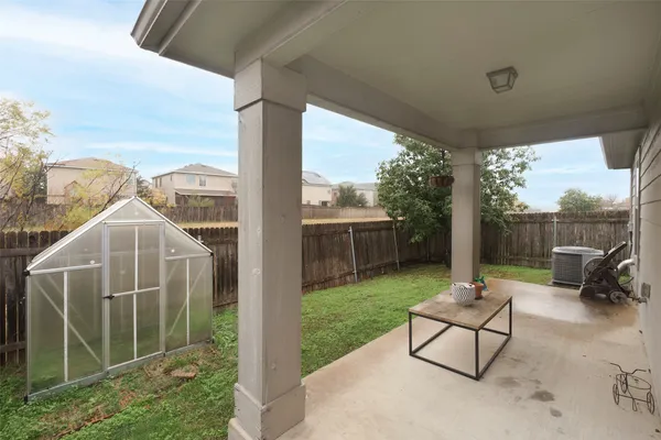 a view of a patio with a yard