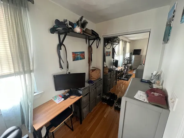 a room with furniture and wooden floor