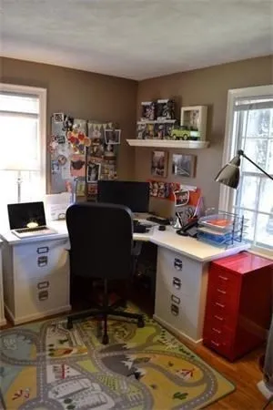 a view of a workspace with furniture