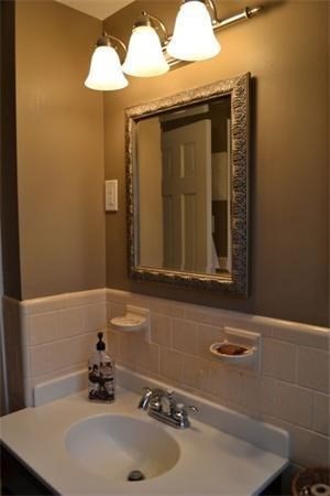 32 Martel Road Hamilton, MA 01982 - Photo 3 of 14 a bathroom with a sink and a mirror
