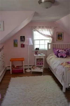 a bedroom with bed and a window