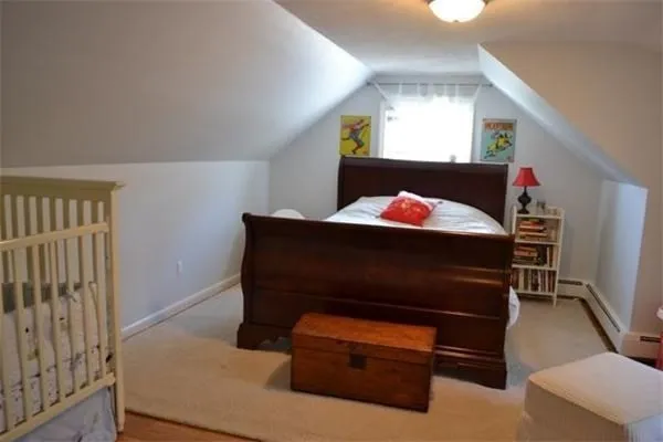 a living room with furniture and a dresser