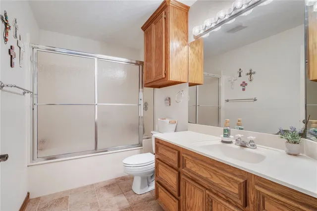 a work room with furniture and a large window