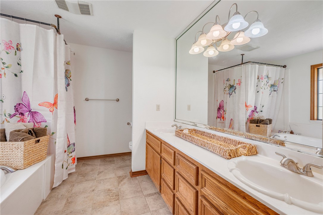 1152 McNutt Road Franklin, TX 77856 - Photo 19 of 38 a bathroom with a sink vanity and a mirror