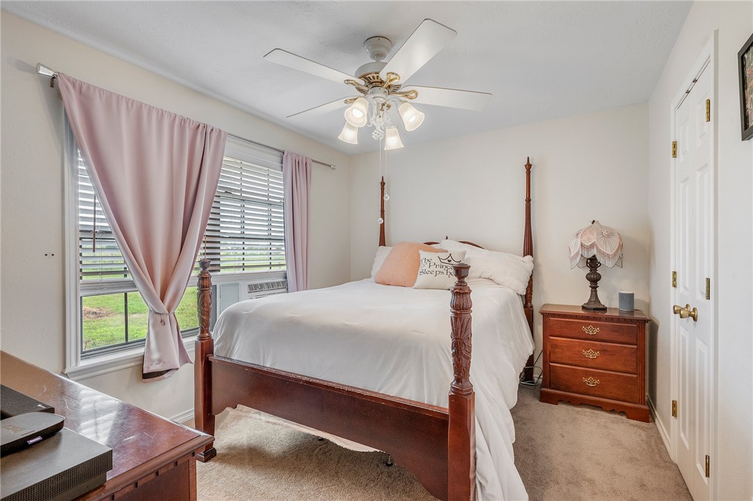 1152 McNutt Road Franklin, TX 77856 - Photo 25 of 38 a bedroom with a bed and a window