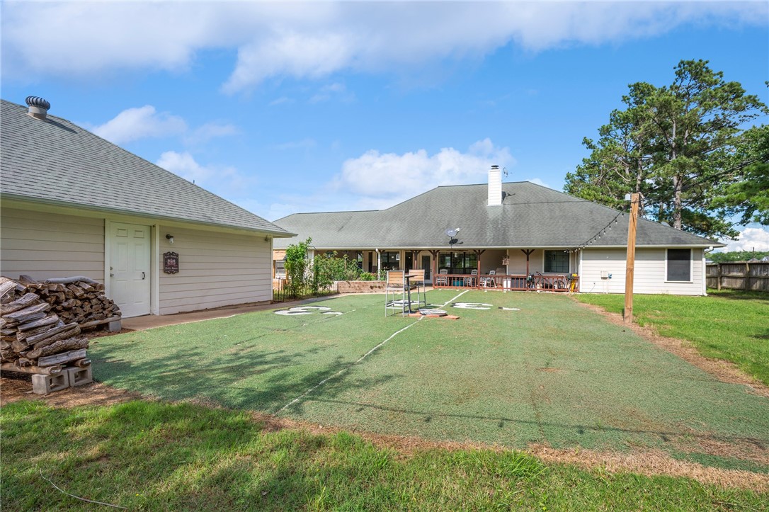 1152 McNutt Road Franklin, TX 77856 - Photo 29 of 38 a backyard of a house with table and chairs