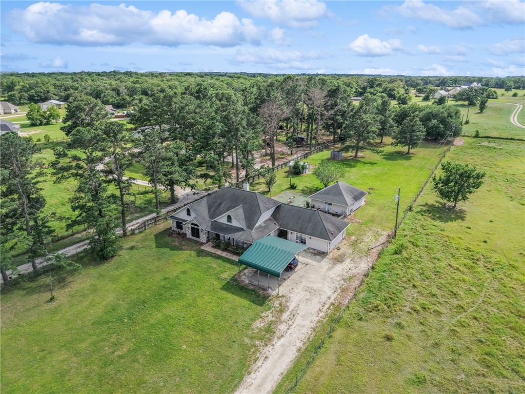 1152 McNutt Road Franklin, TX 77856 - Photo 34 of 38 an aerial view of a house with a yard