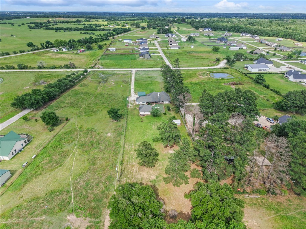 1152 McNutt Road Franklin, TX 77856 - Photo 35 of 38 a view of a houses with outdoor space and yard