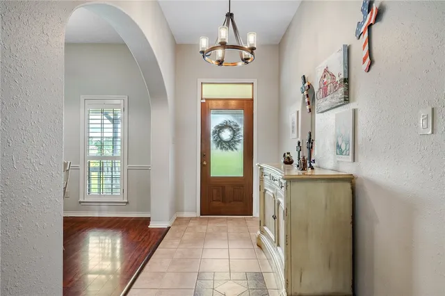 a dining room with furniture window and wooden floor