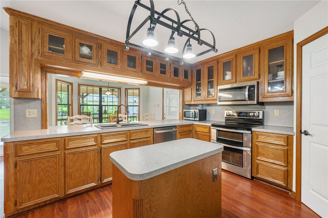 1152 McNutt Road Franklin, TX 77856 - Photo 6 of 38 a kitchen with stainless steel appliances granite countertop a stove and a sink