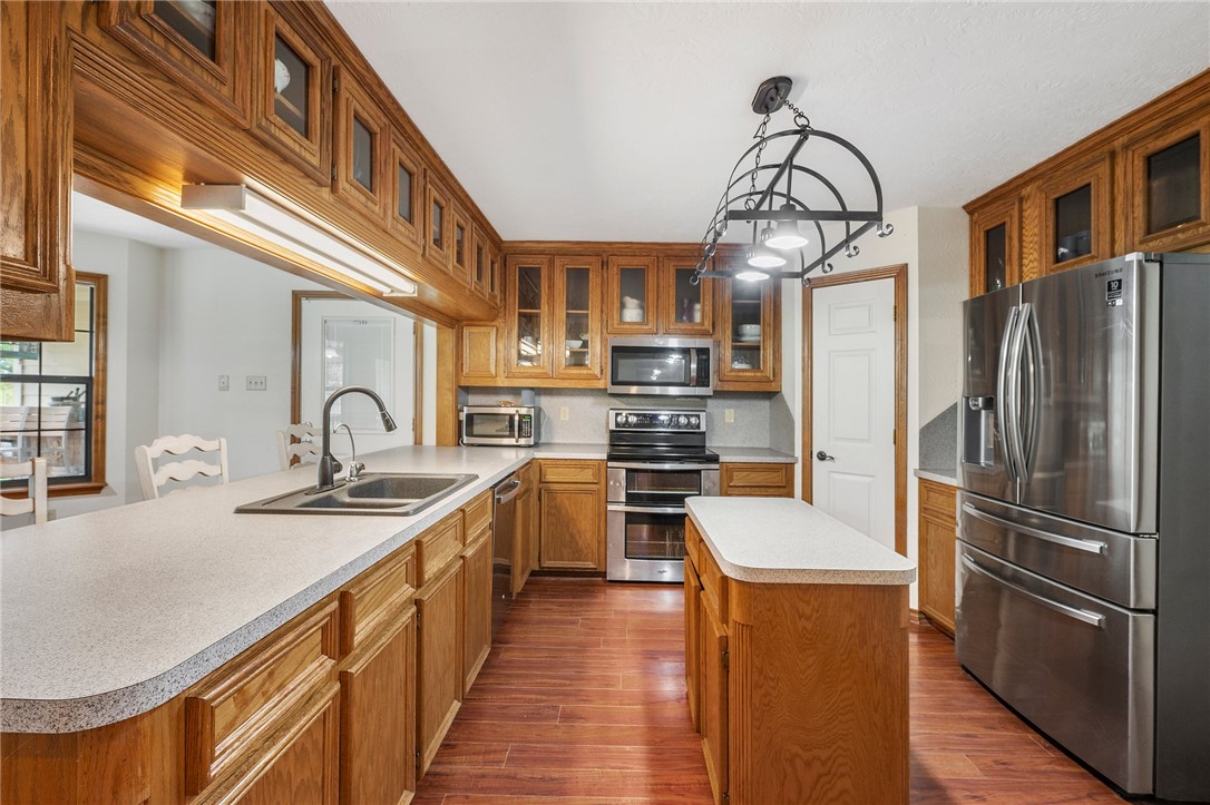 1152 McNutt Road Franklin, TX 77856 - Photo 7 of 38 a kitchen with stainless steel appliances granite countertop a sink a stove and refrigerator