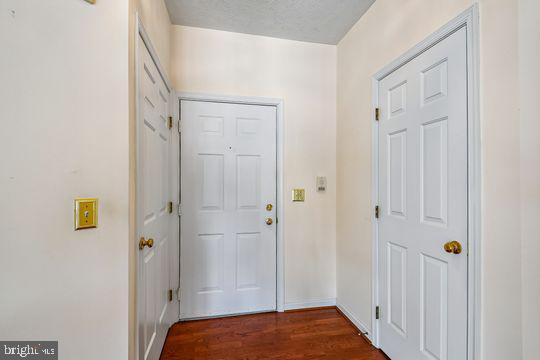 9511 Kingscroft Terrace, Unit 9511F Perry Hall, MD 21128 - Photo 7 of 38 a view of bedroom with a bed and wooden floor