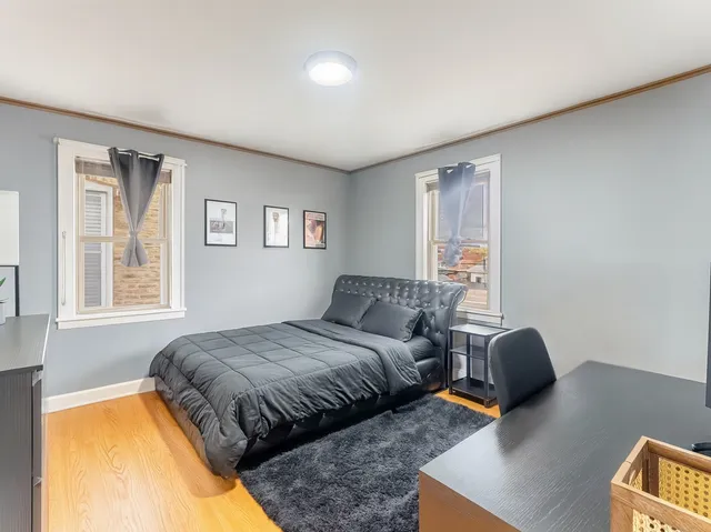 a bedroom with bed and a window