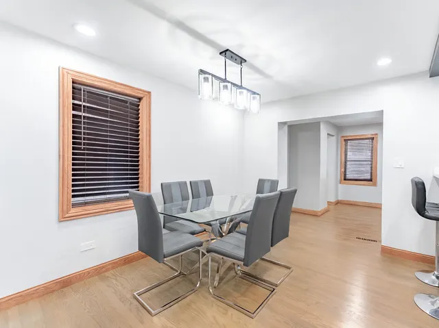 a view of a dining room with furniture and window
