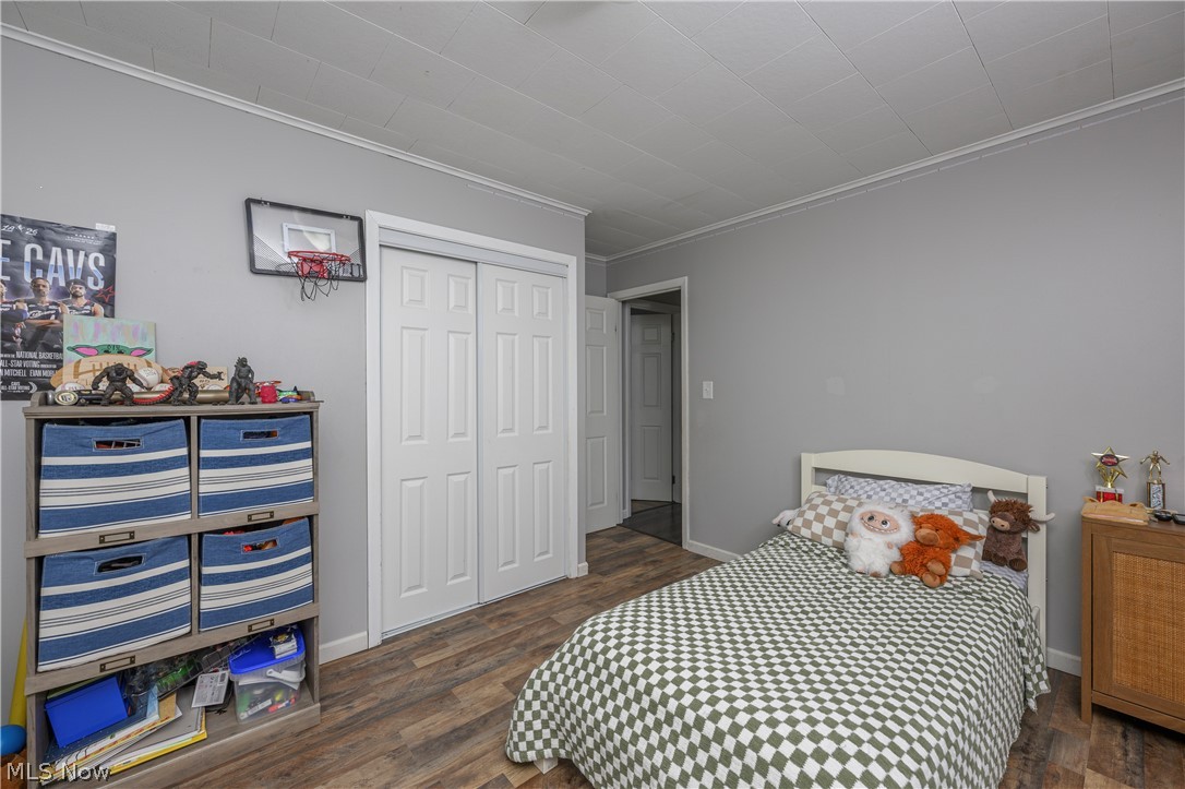 6105 Wolf Run Road Southeast Dennison, OH 44621 - Photo 28 of 35 Interior room featuring wood-finish flooring and light gray walls