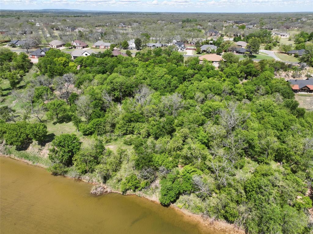 9804 Bellechase Road Granbury, TX 76049 - Photo 17 of 18 an aerial view of residential houses with outdoor space and trees