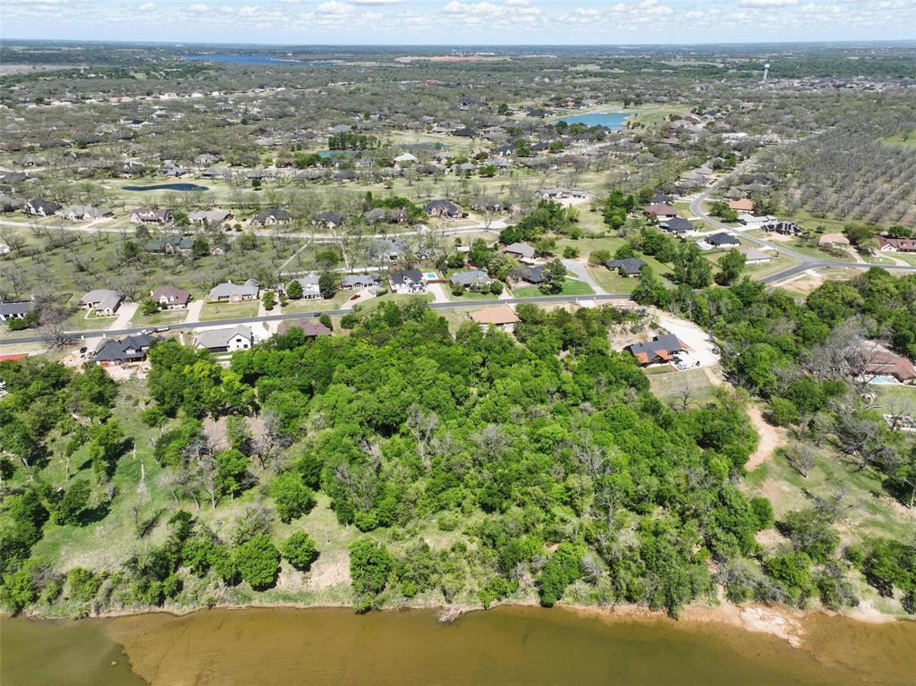 9804 Bellechase Road Granbury, TX 76049 - Photo 18 of 18 an aerial view of residential houses with outdoor space and trees