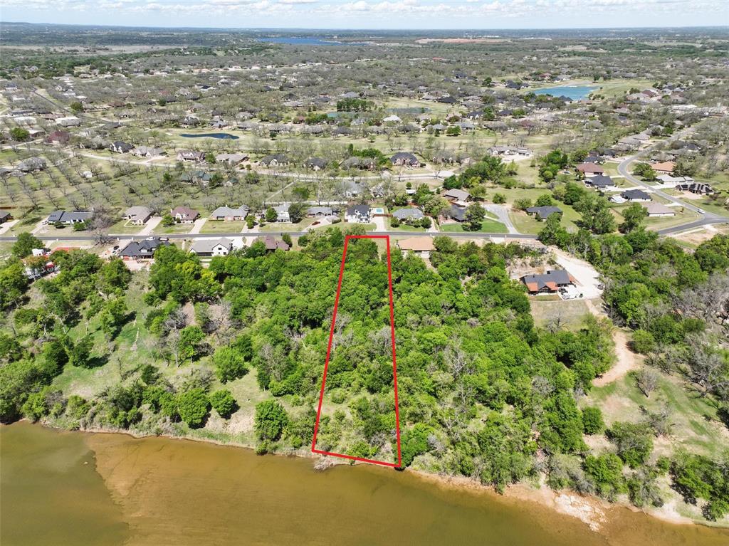 9804 Bellechase Road Granbury, TX 76049 - Photo 7 of 18 an aerial view of residential houses with outdoor space and trees