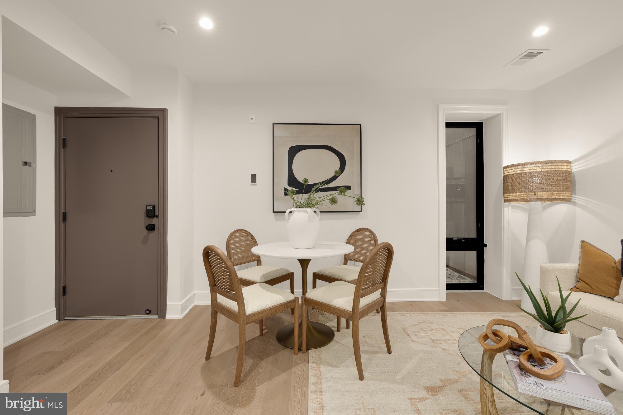 1463 Harvard Street Northwest, Unit 2 Washington, DC 20009 - Photo 4 of 25 a dining room with furniture and wooden floor