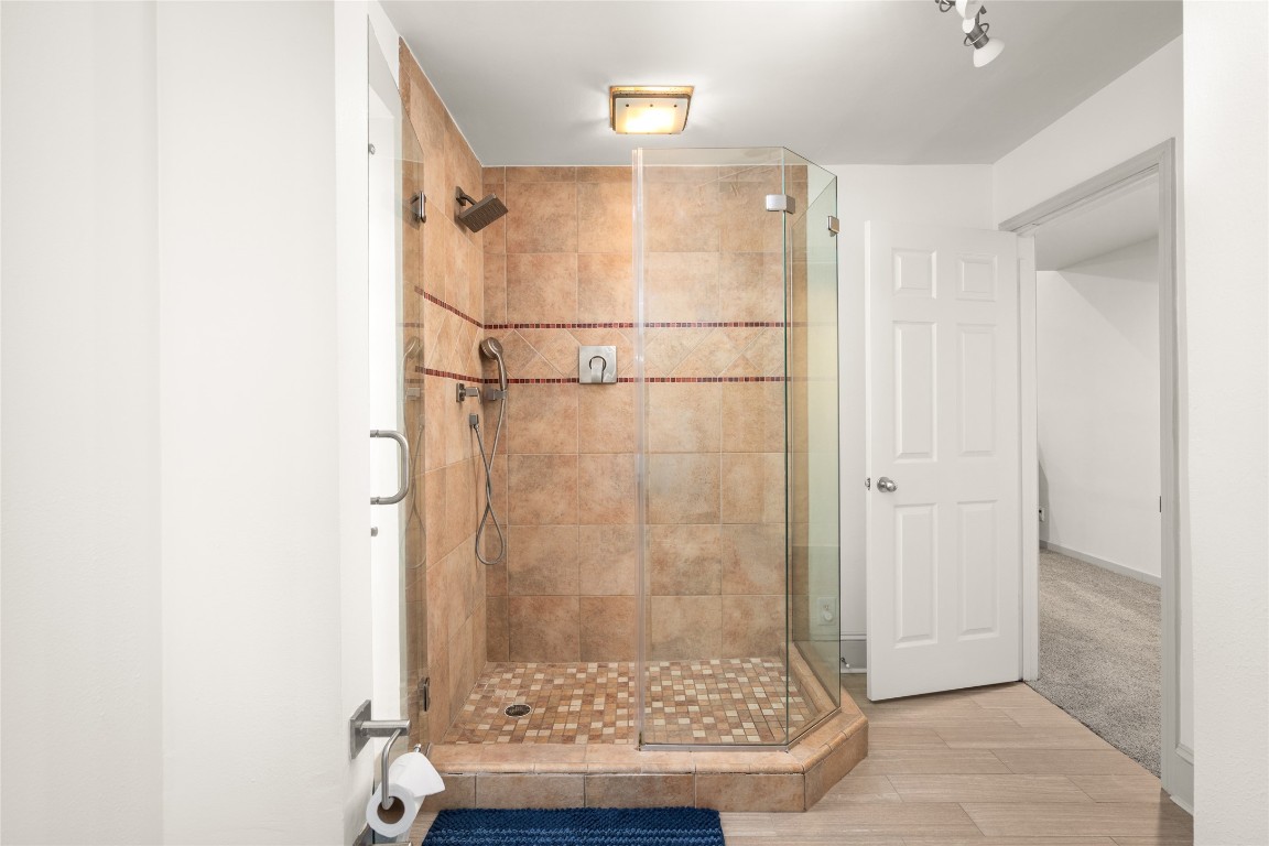 7409 South Rice Avenue Bellaire, TX 77401 - Photo 16 of 26 Walk-in shower in primary bath
