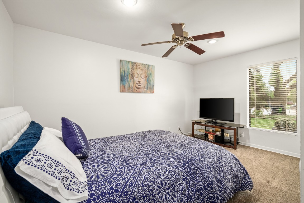 7409 South Rice Avenue Bellaire, TX 77401 - Photo 17 of 26 Secondary bedroom downstairs. Perfect for multi-generational living.