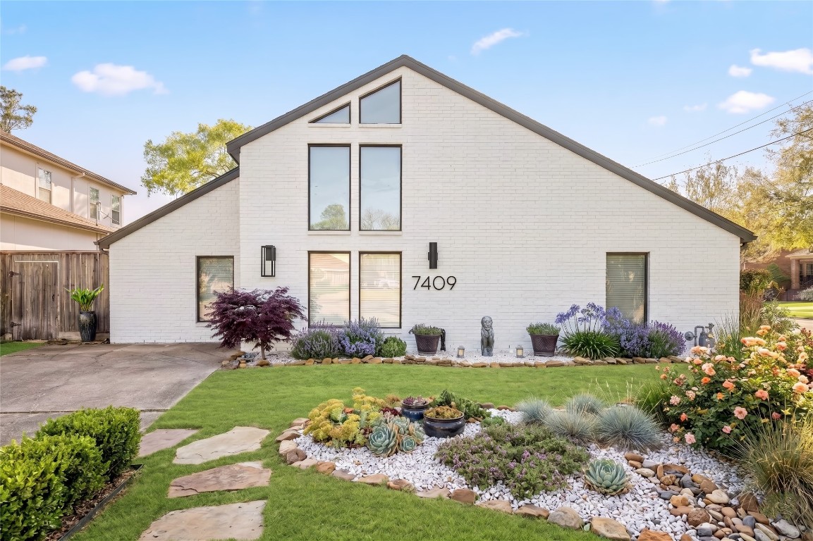 7409 South Rice Avenue Bellaire, TX 77401 - Photo 2 of 26 Virtual rendering, exterior painted white and landscaping added in.