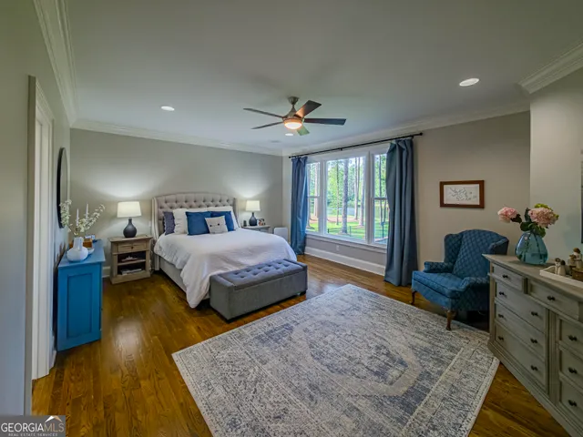 a living room with furniture and a book shelf