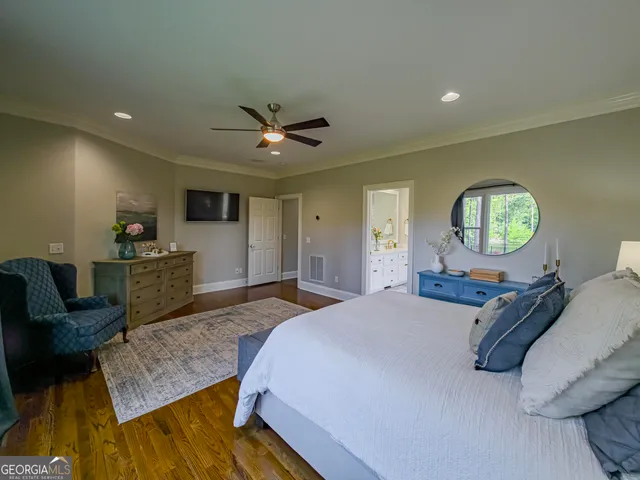 a bedroom with furniture and a window