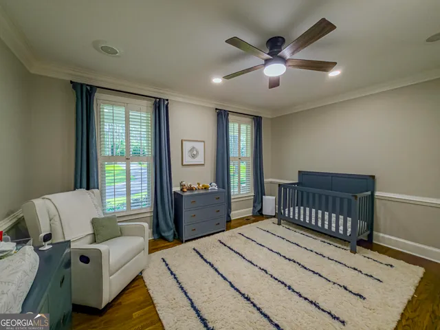 a bedroom with a bed and a chair