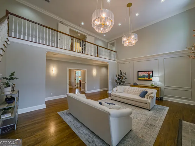 a kitchen with granite countertop a sink refrigerator and cabinets