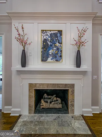 a kitchen with stainless steel appliances kitchen island granite countertop a table and chairs in it