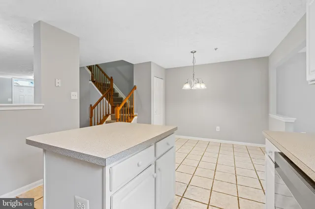 a view of a kitchen cabinets and wooden floor