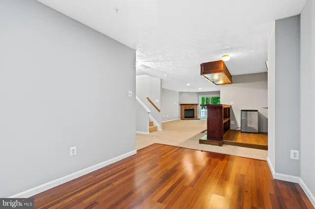 a view of a living room and wooden floor