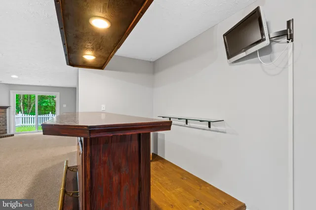 a view of a hallway with furniture