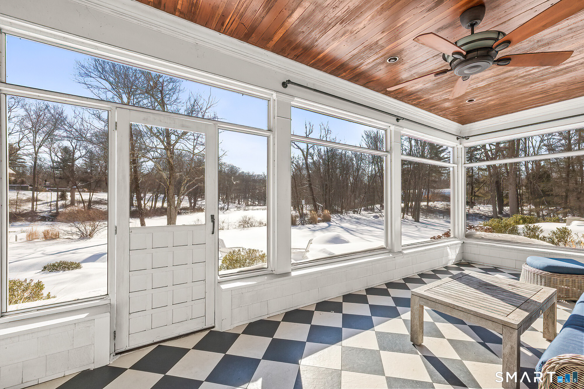 77 Golf Lane Ridgefield, CT 06877 - Photo 20 of 41 Screened in porch with views of the expansive backyard and pond.