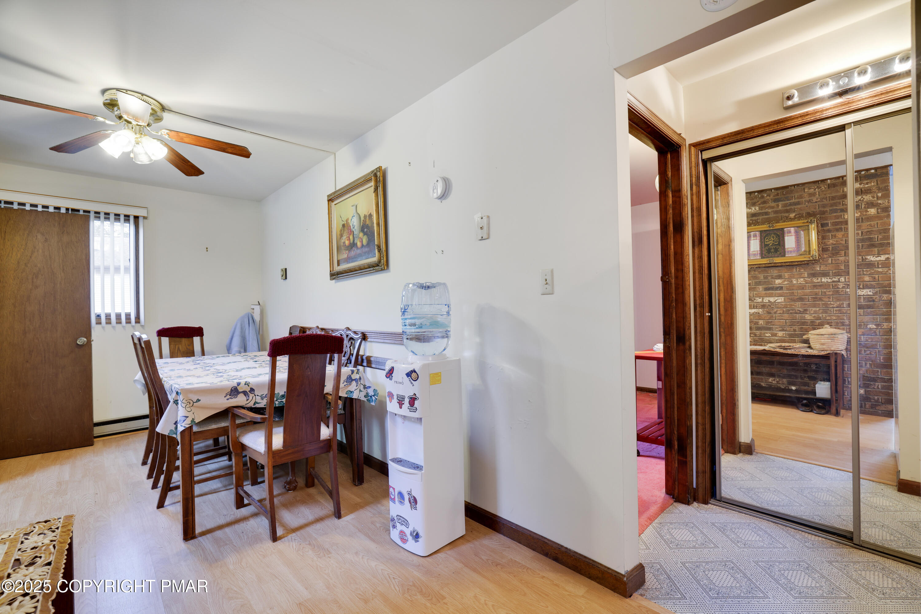 385 Saunders Drive Bushkill, PA 18324 - Photo 19 of 42 a view of a dining room with furniture and chandelier