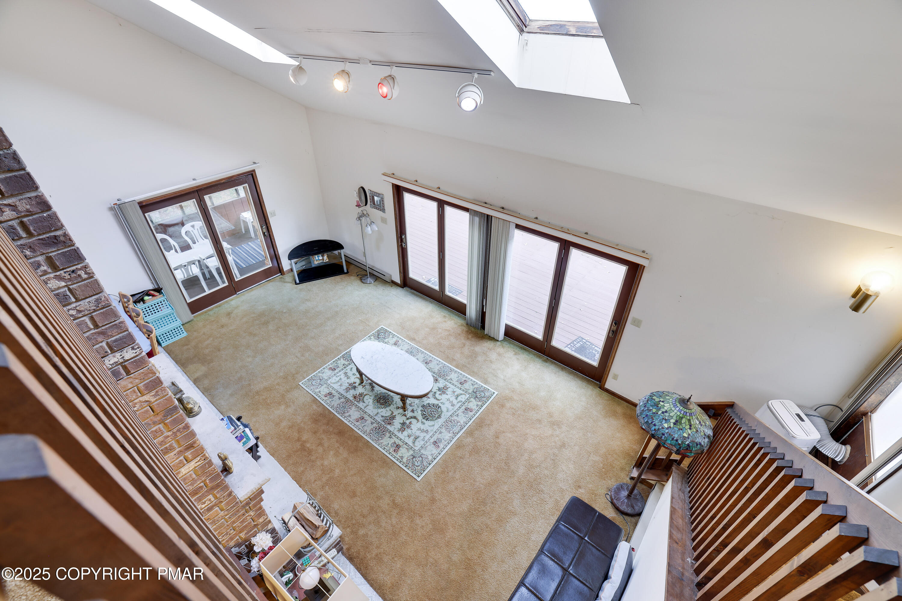 385 Saunders Drive Bushkill, PA 18324 - Photo 27 of 42 a living room with furniture and a window