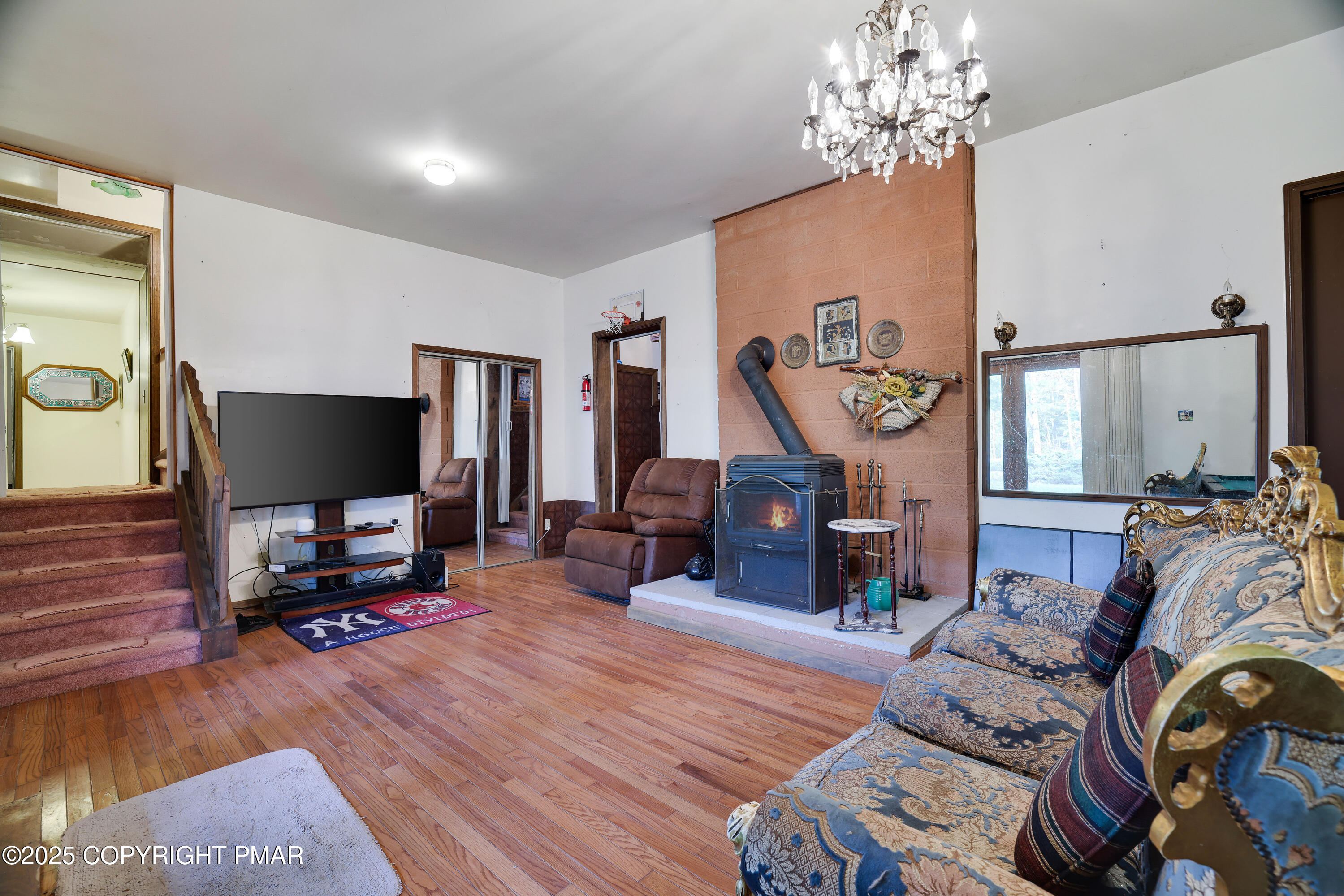 385 Saunders Drive Bushkill, PA 18324 - Photo 4 of 42 a living room with furniture and a flat screen tv