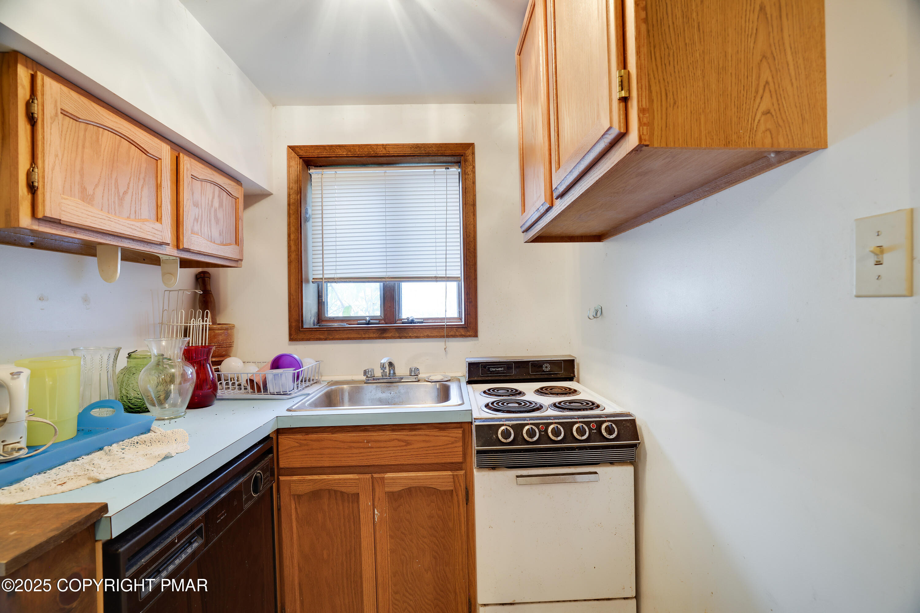 385 Saunders Drive Bushkill, PA 18324 - Photo 8 of 42 a kitchen with stainless steel appliances a sink a stove and a refrigerator