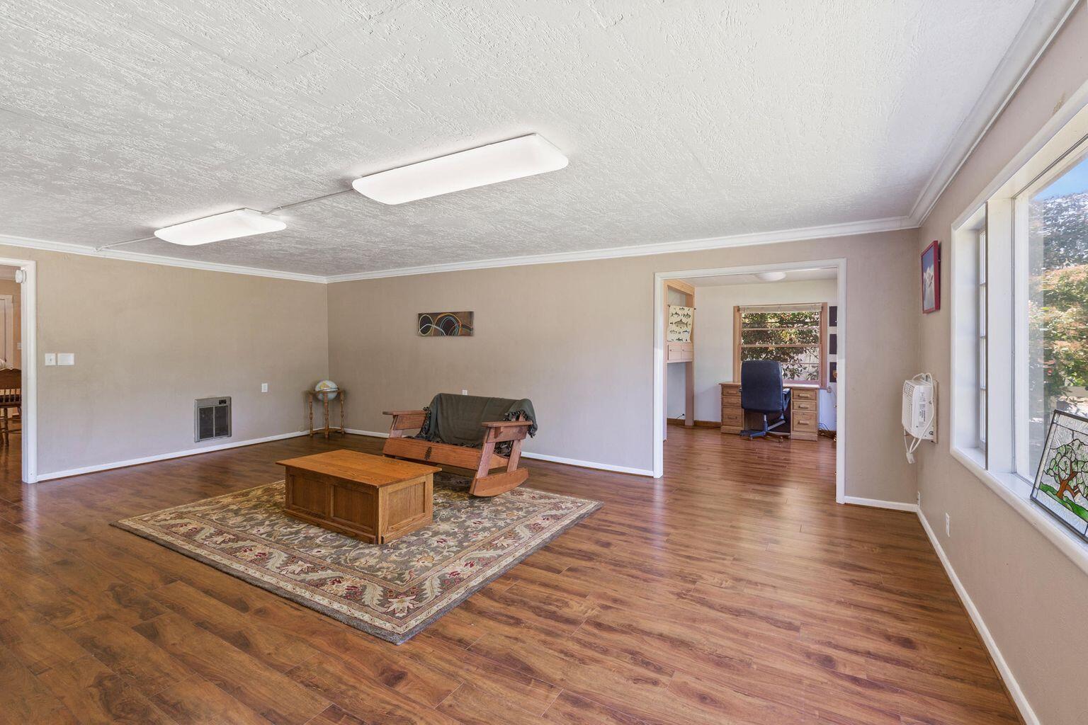 4601 Lower River Road Grants Pass, OR 97526 - Photo 11 of 36 a living room with furniture and a rug
