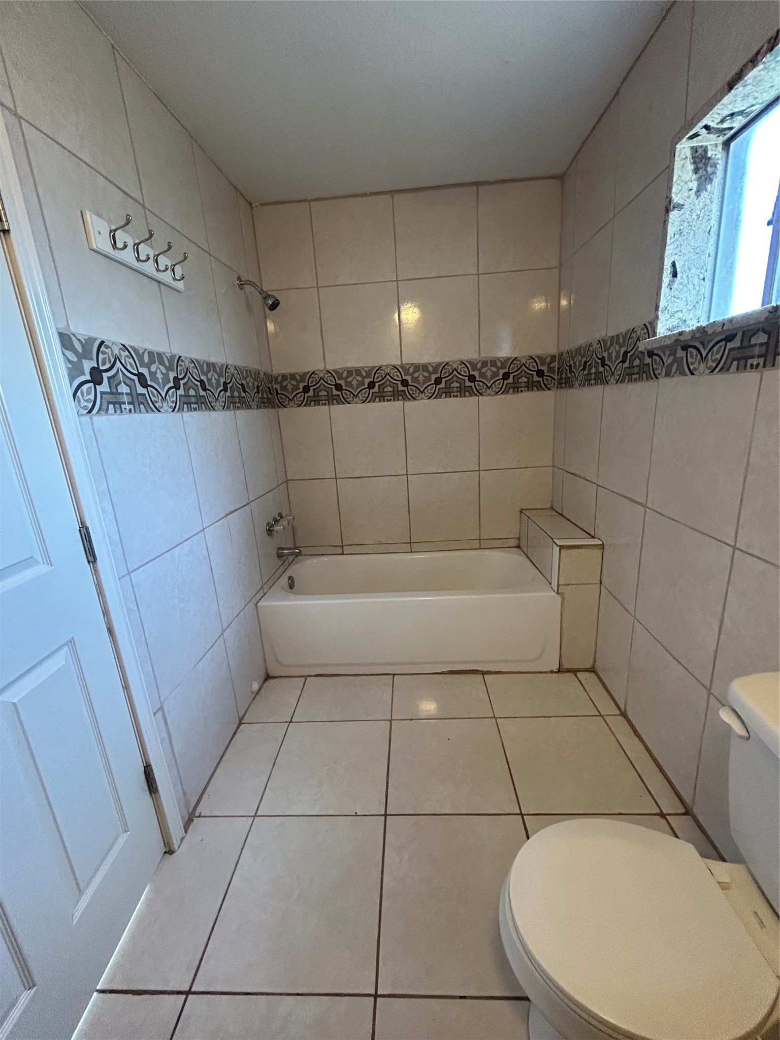 5811 East S F Austin Road Freeport, TX 77541 - Photo 18 of 26 a bathroom with a bathtub and toilet