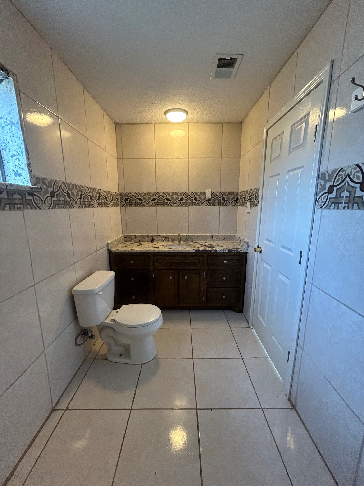 5811 East S F Austin Road Freeport, TX 77541 - Photo 19 of 26 a bathroom with a sink and mirror
